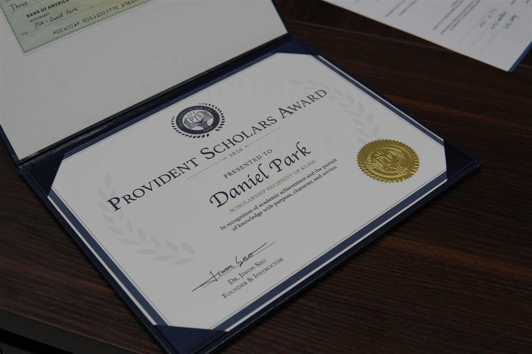 Close-up of the 2026 Provident Scholars Award certificate presented to Daniel Park.